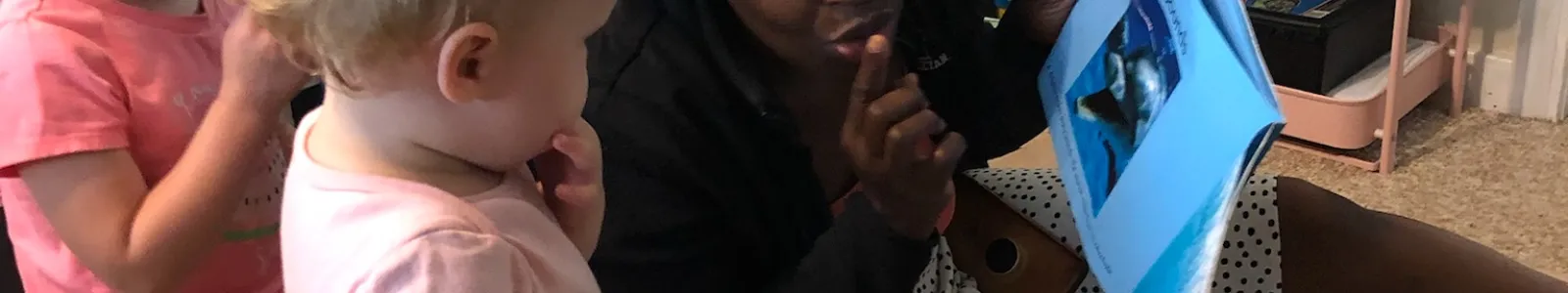 Adult reading to child